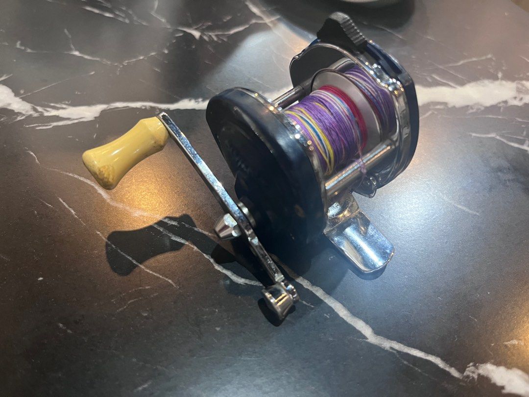 Olympic New Midget No. 4 Fishing Reel baitcaster (Category: Fishing) located in Singapore. Submitted by makeoldstuffnew (Listing ID 1405820546, Image 3). Description: Rare vintage baitcaster reel collectables. Type: Miniature baitcasting reel (double axis reel). Best Use: Small freshwater species, such as shrimp or trout. Cast-able but old technology requires you to exercise thumb control to avoid bird nest. Vintage: As a vintage model, it is als
