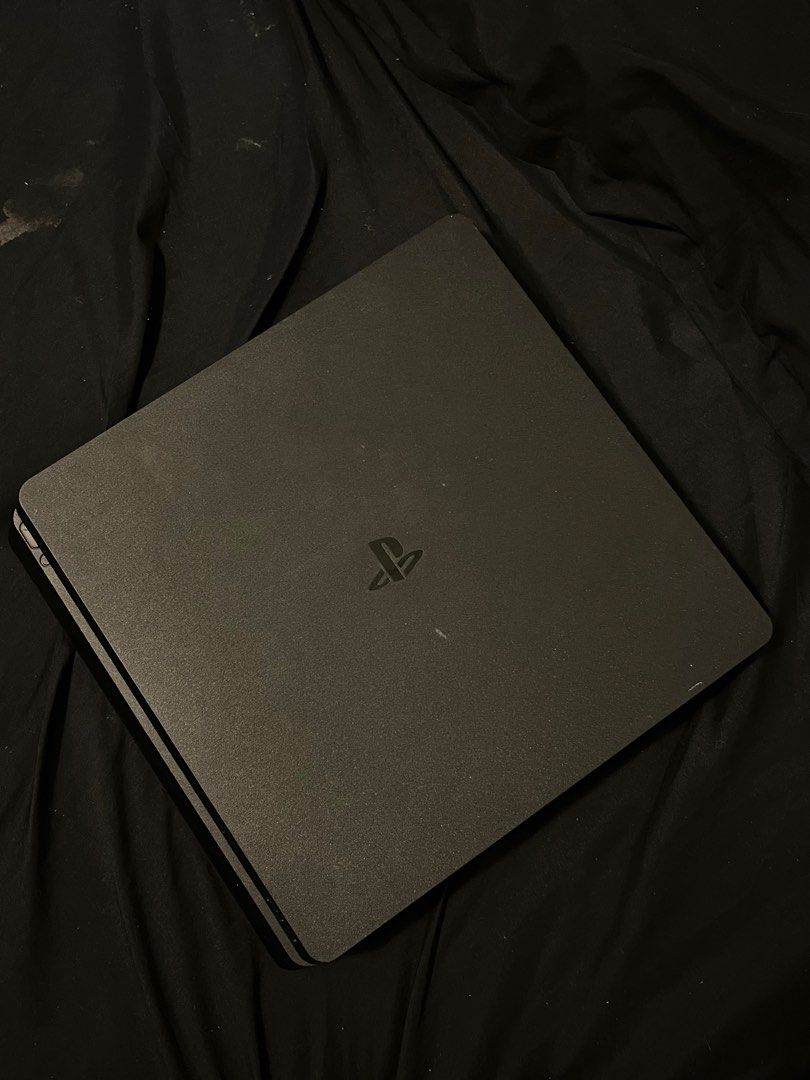 Sony PlayStation 4 Console with Accessories (Category: PlayStation) located in Manila. Submitted by kaeseydc (Listing ID 1405904231, Image 3). Description: - PlayStation 4 console (black) - Two black controllers (w/o thumb grips) - Charging stand for controllers - Power cable included - HDMI cable included - Jailbreak — GoldHen - Ver. 12.00 GAMES: - NBA2k26 - UFC 4 - A WAY OUT - ATTACK ON TITAN 2 - AC MIRAGE - AC ODYSSEY - GHOST TSUSHIMA - AC SYN