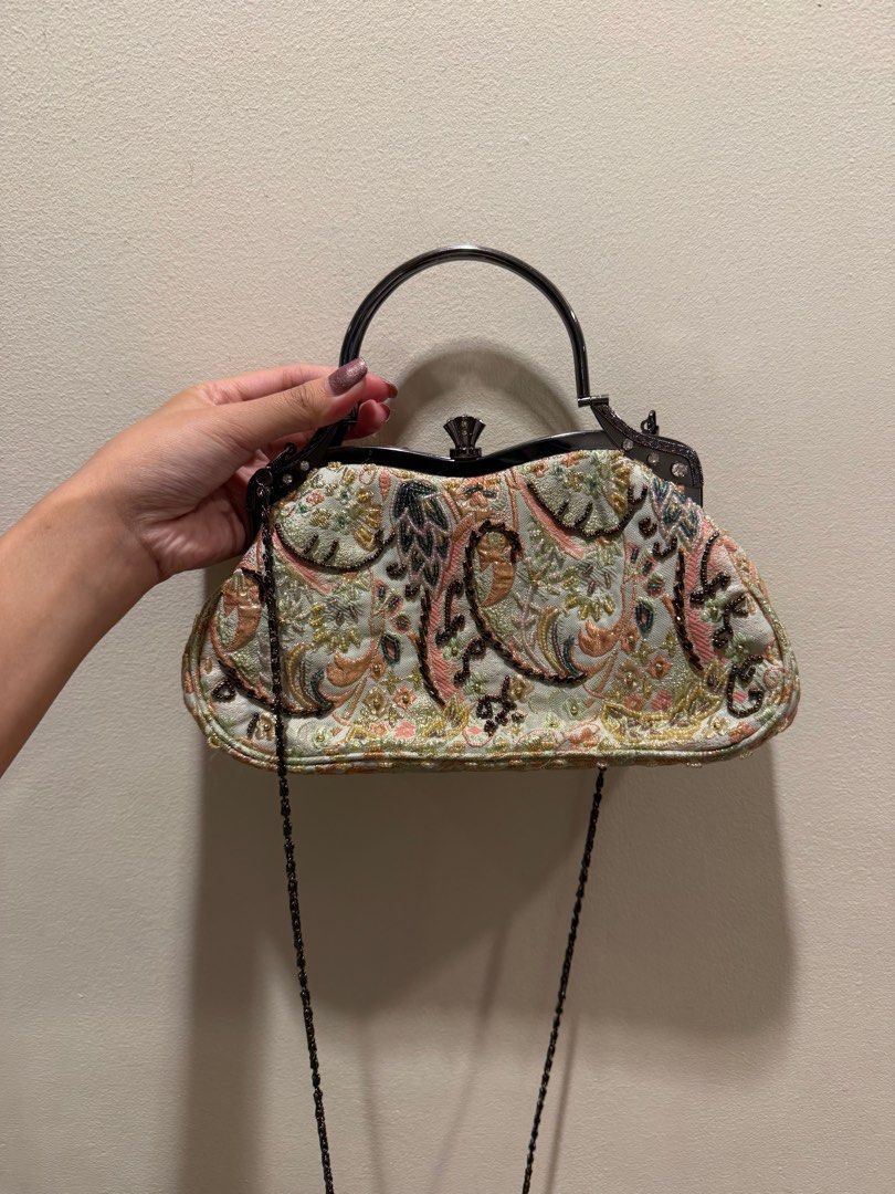 Vintage Embroidered Handbag (Category: Luxury Bags & Wallets) located in Las Pinas. Submitted by privari (Listing ID 1405850875, Image 1). Description: - Vintage handbag - Intricate floral embroidery in pastel colors - Structured frame with top handle - Detachable chain strap - Light-colored fabric lining - Small interior pocket - Embellished with beads and rhinestones.