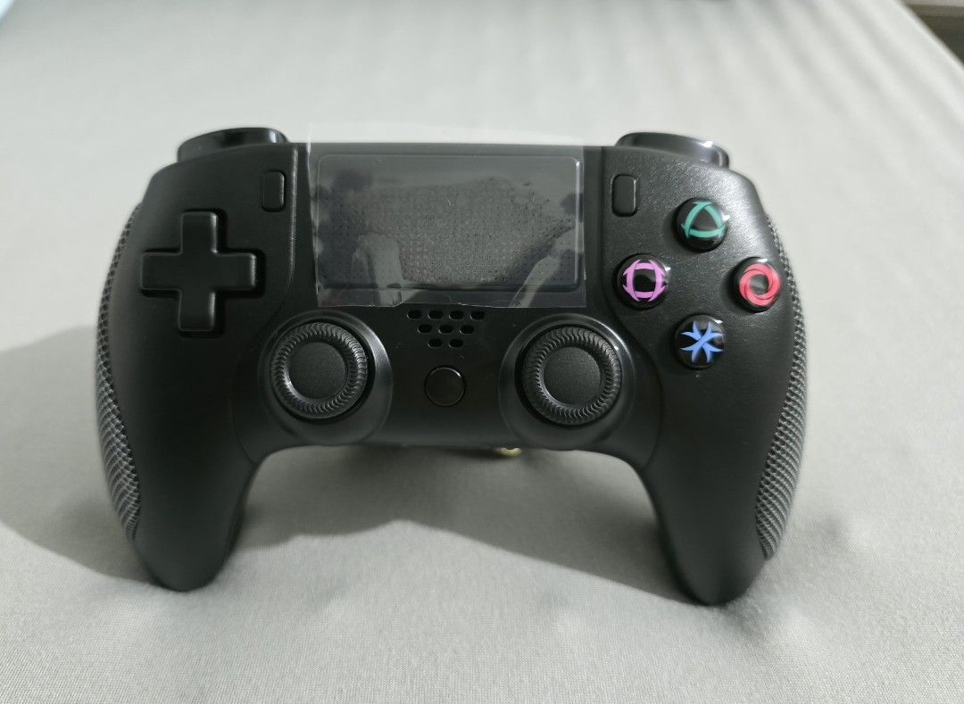 Wireless Controller for PS4 (Category: Controllers) located in Manila. Submitted by a.dr27 (Listing ID 1405856951, Image 1). Description: LIKE NEW tinest lang sa laptop - Wireless controller for PS4 - Black design - Includes controller, box, and charging cable - Textured grips for enhanced comfort - Features all standard buttons and touchpad.
