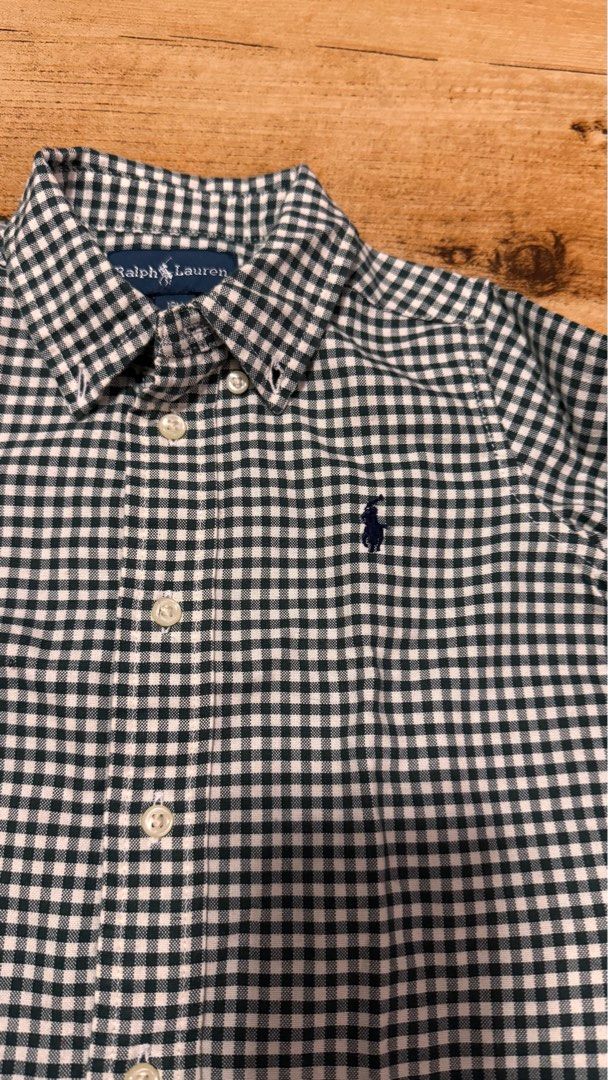 [18m] Ralph Lauren Gingham Check Shirt (Category: Babies & Kids Fashion) located in Cabuyao City. Submitted by mamamara19 (Listing ID 1406041693, Image 2). Description: Note: Can't vouch for the authenticity - it was given as a gift and was not personally bought but fabric is very good and hindi mainit (airy) - Ralph Lauren long-sleeved shirt - Classic gingham check pattern - Size: 18M - Features button-down collar - Small embroidered logo - Ligh