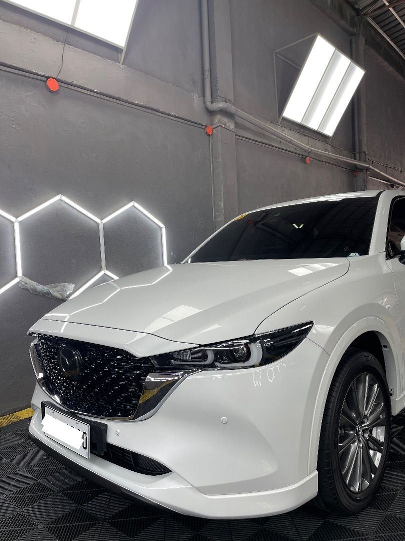 2024 Mazda CX-5 AWD Turbo (Category: Heavy Vehicles) located in Makati City. Submitted by deautotrading (Listing ID 1405941932, Image 1). Description: For sale: 2024 Mazda CX-5 AWD Turbo Gas Price: P2,000,000 Casa maintained No issues *Top of the line variant* - Rhodium White Premium - Dynamic Pressure Turbo SKYACTIV-G 2.5L - I-ACTIV All-Wheel Drive - Automatic w/ Sports Mode - G-Vectoring Control Plus - IGL Graphene Coatings (mags included) - Pu