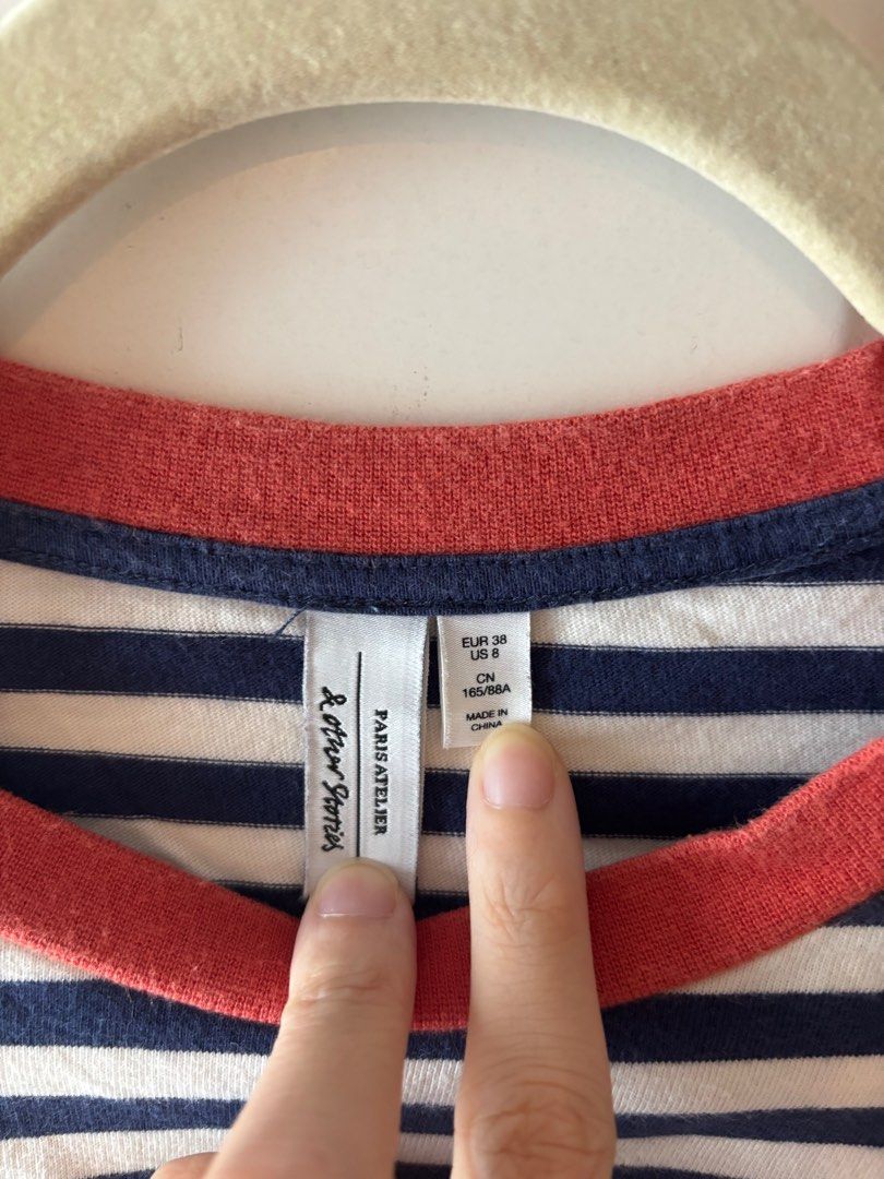 & Other Stories Striped Long Sleeve Top (Category: Longsleeves) located in Makati City. Submitted by geministyle (Listing ID 1405935451, Image 2). Description: - Classic navy and white striped long-sleeved top - Features a contrasting orange neckline - Size: EUR 38 / US 8 (fits like a medium).