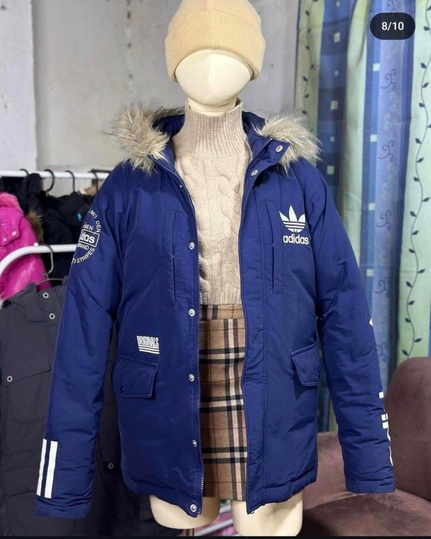 Adidas Blue Winter Jacket with Fur Hood (Category: Coats, Jackets and Outerwear) located in Marilao. Submitted by beeeeth_04 (Listing ID 1406083028, Image 1). Description: - THRIFTED for 1500 - LP posted - Ive never worn it since bought - Adidas winter jacket - Stylish blue exterior - Adidas logo on chest - Iconic stripes on sleeves - Fur-lined hood for extra warmth - Multiple pockets for storage - Perfect for cold weather - Decluttering.