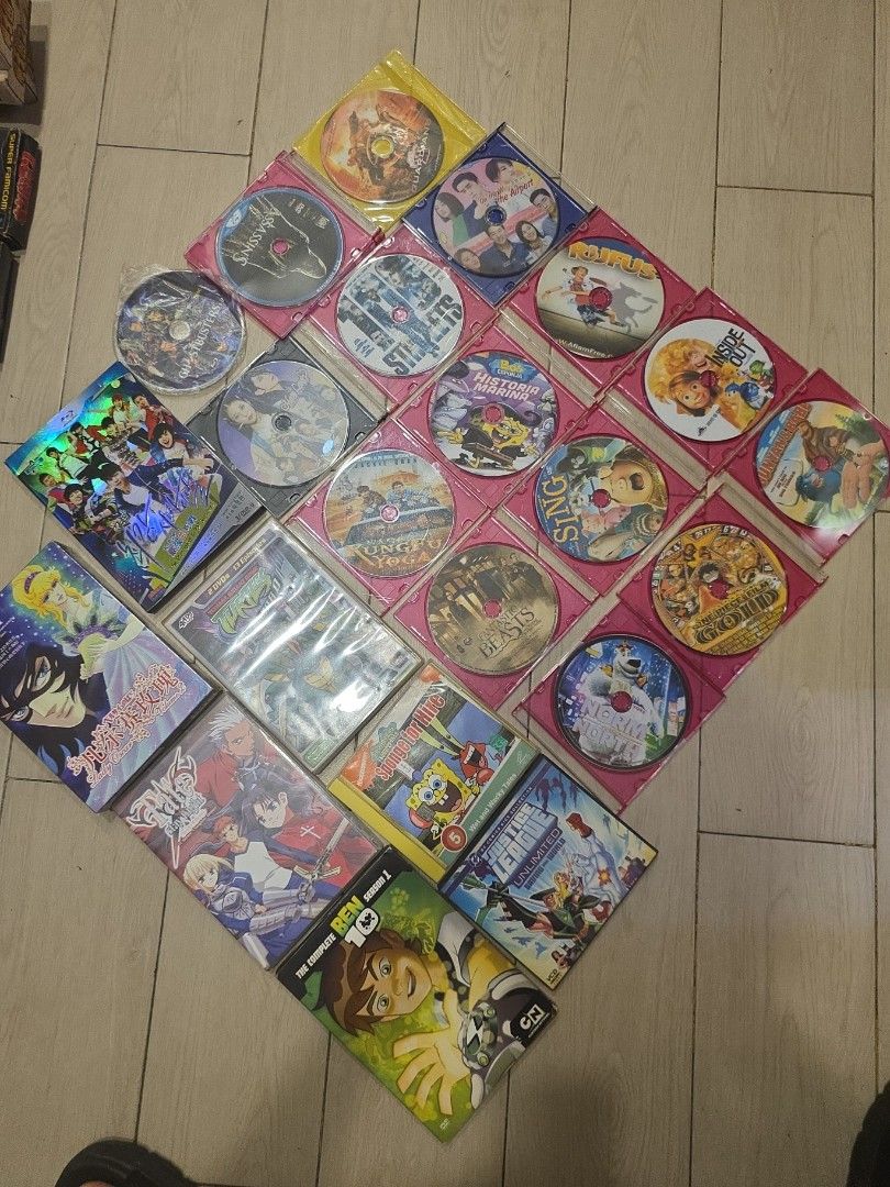 Assorted Anime and Cartoon DVDs (Category: CDs & DVDs) located in Manila. Submitted by read_description (Listing ID 1406001475, Image 1). Description: - take all 100 -Assorted anime and cartoon DVDs - Includes titles like Ben 10, Sailor Moon, and other animated movies - DVDs are in original cases - Some cases are pink - A mix of different series and movies.