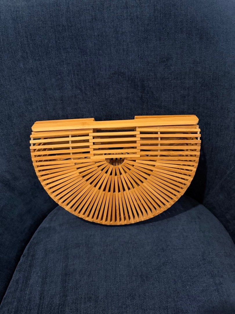 Bamboo Bag (Cult Gaia Inspired) (Category: Clutches) located in Makati City. Submitted by mikaoreyes93 (Listing ID 1406044928, Image 1). Description: Bought in Taiwan - Cult Gaia inspired bamboo handbag - Made with thin bamboo slats - Natural light brown color - Open and airy design - Suitable for various occasions.