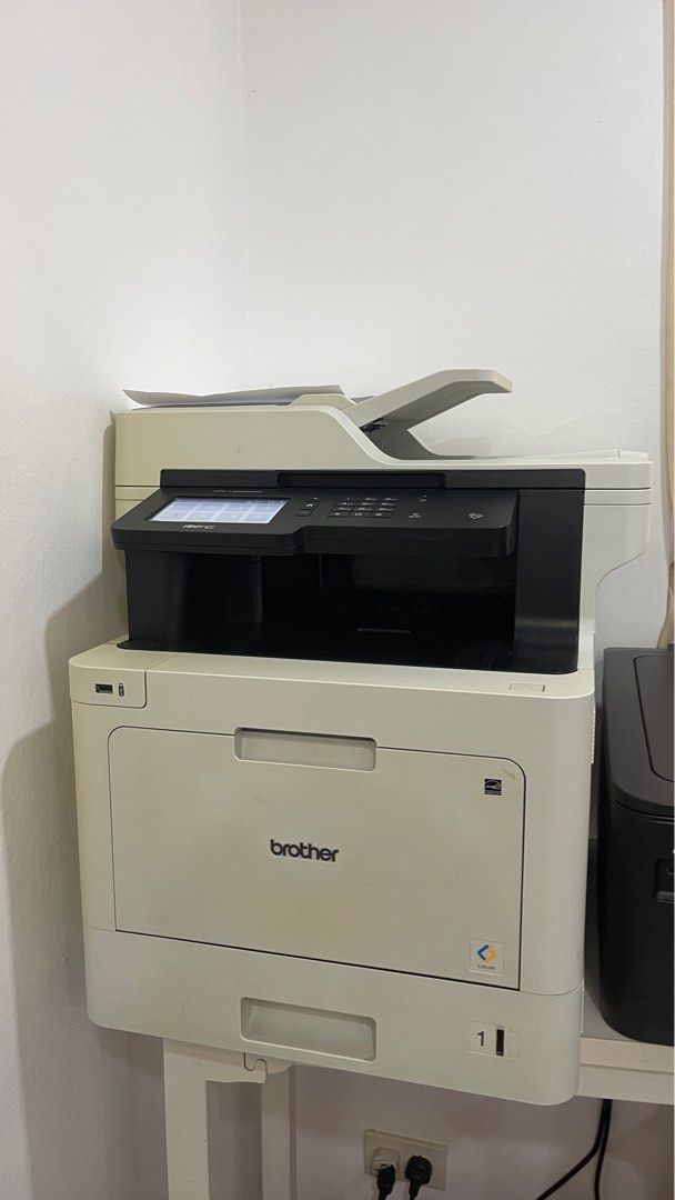 Brother MFC-L8900CDW Color Laser Printer (Category: Printers, Scanners & Copiers) located in Quezon City. Submitted by clezzyy (Listing ID 1405957049, Image 1). Description: - Brother MFC-L8900CDW color laser printer - Color laser printing - Touchscreen control panel - Includes document feeder - White and black color scheme - Features a paper tray - In good working condition.