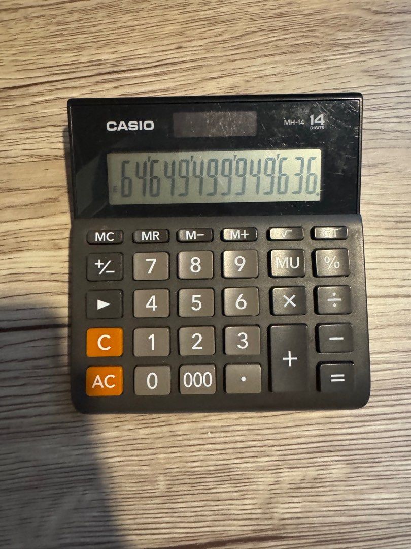 Casio MH-14 Calculator (Category: Office & Business Technology) located in Pasay City. Submitted by mocksteals (Listing ID 1406070010, Image 3). Description: - Negotiable - No box - Casio MH-14 Calculator - 14-digit display - Basic functions: Percentage, Memory, Square Root - Black body with gray buttons .