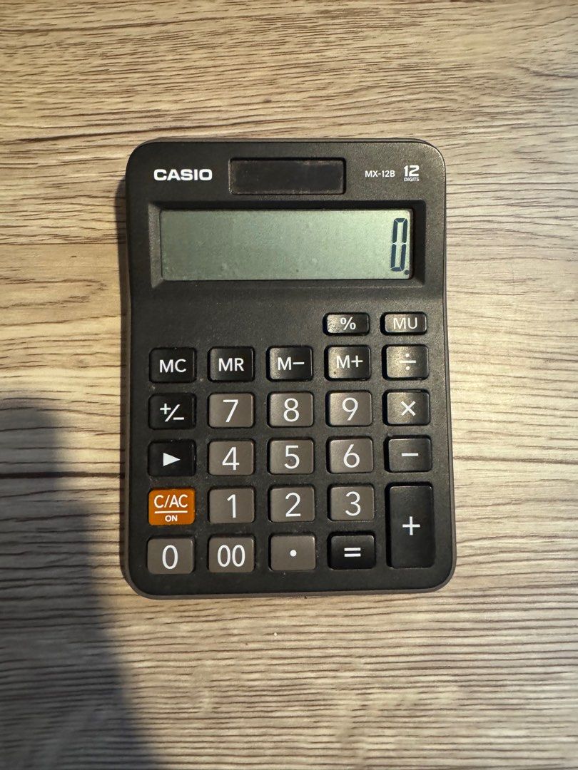 Casio MX-12B Calculator (Category: Office & Business Technology) located in Pasay City. Submitted by mocksteals (Listing ID 1406069635, Image 2). Description: - Negotiable - No box - Casio MX-12B Calculator - 12-digit display - Solar powered and battery operated (LR54) - Basic functions: Percentage, Memory, Square Root - Black body with gray buttons - Made in China.