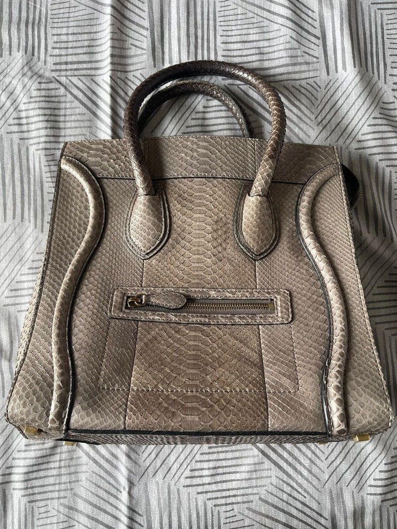 Celine Python Leather Handbag (Category: Bags & Wallets) located in Singapore. Submitted by drewtcg (Listing ID 1406021411, Image 1). Description: - Authentic Celine handbag - Genuine python leather - Top handle design - Zip closure - Interior with branded leather tag - Made in Italy - Stylish and luxurious Condition - Used well.