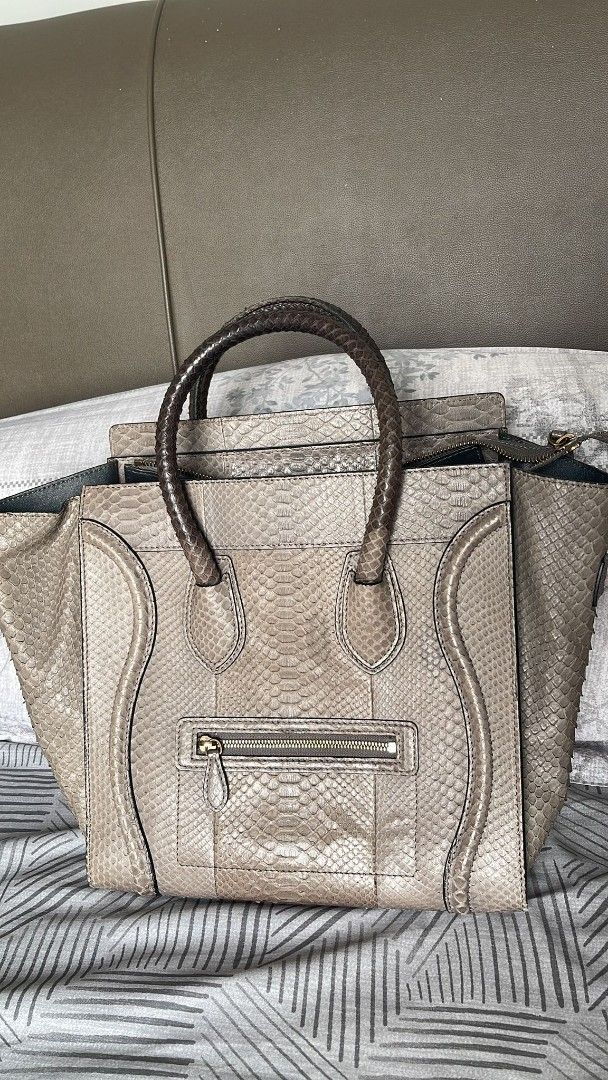 Celine Python Leather Handbag (Category: Bags & Wallets) located in Singapore. Submitted by drewtcg (Listing ID 1406021411, Image 2). Description: - Authentic Celine handbag - Genuine python leather - Top handle design - Zip closure - Interior with branded leather tag - Made in Italy - Stylish and luxurious Condition - Used well.