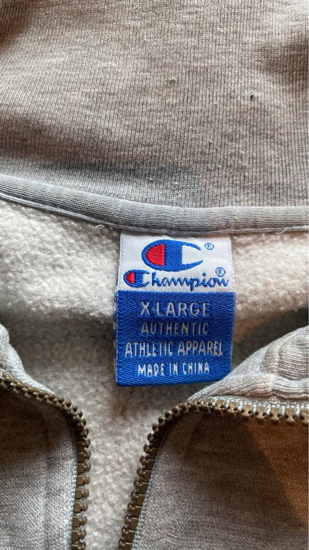 Champion Quarter Zip Sweatshirt XL (Category: Coats, Jackets and Outerwear) located in Mandaluyong City. Submitted by choloooo (Listing ID 1405979924, Image 2). Description: - Champion quarter zip sweatshirt - Color: Grey - Size: XL - Features Champion logo on chest and sleeve - Two front pockets - Zipper closure - Made in China.