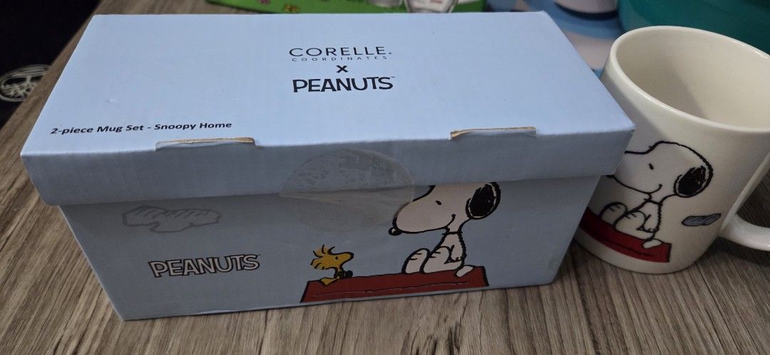 Original Corelle x Peanuts 2-Piece Mug Set (Category: Coffee & Tea Tableware) located in Manila. Submitted by sterling_grace (Listing ID 1405968861, Image 2). Description: - 2-piece mug set featuring Snoopy and Woodstock - From the Peanuts collection - Comes in a box with Corelle x Peanuts branding - White mugs with Snoopy design - Ideal for coffee, tea, and Peanuts fans.