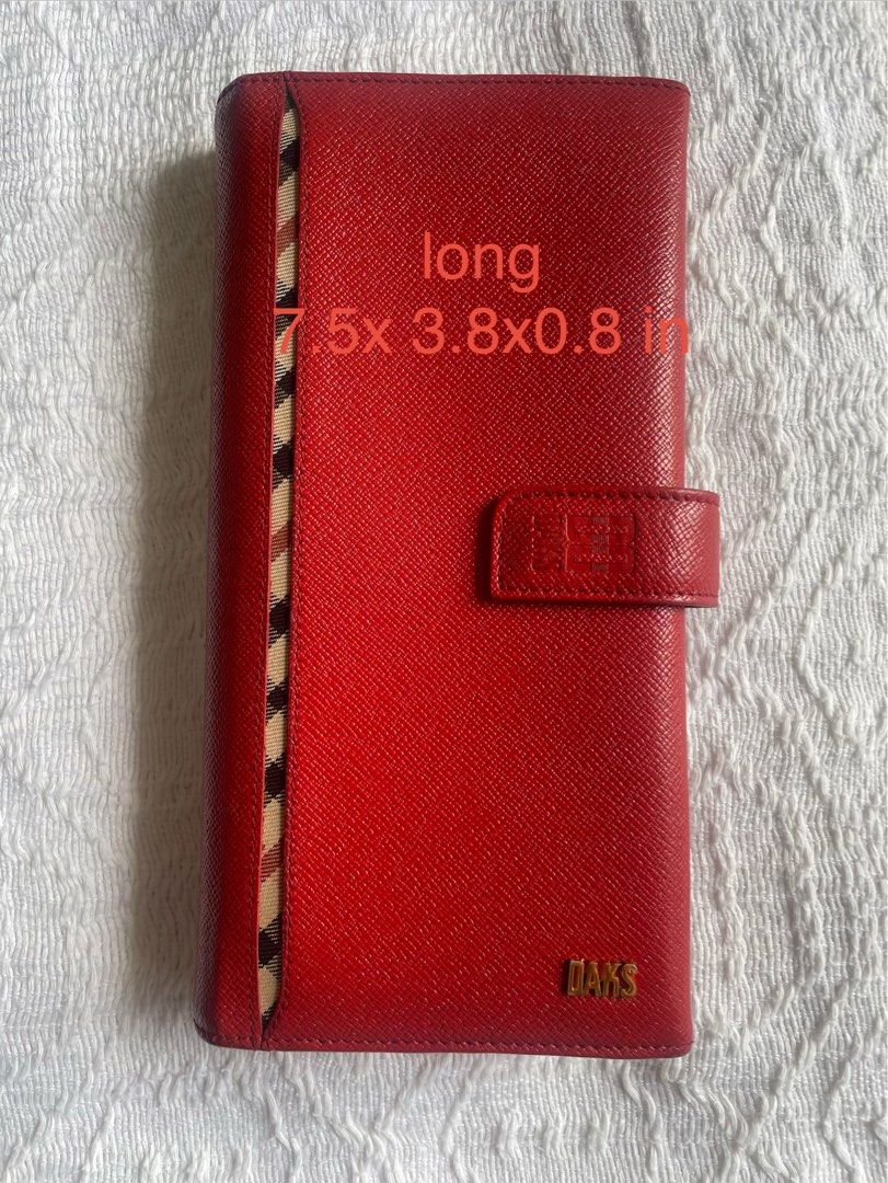 DAKS Long Wallet (Category: Wallets & Card holders) located in Cainta. Submitted by robbynt (Listing ID 1405923955, Image 1). Description: 👗👟👜 Part of my closet clean-out! Letting go of some of my faves — all preloved and in great shape. From my closet to yours. 😊 ✅ Color - red orange ✅ Size - long ✅ Hardware - gold ✅ Closure - snap ✅ Bifold ✅ 11 card slots ✅ 2 photo slots ✅ 1 deep compartment ✅ 6 paper compartments ✅ 1 zipper compartment ♻️ 