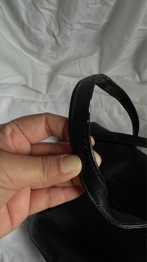 Dolce & Gabbana Black Shoulder Bag (Category: Luxury Bags & Wallets) located in Quezon City. Submitted by hollyyybac25473 (Listing ID 1405988983, Image 3). Description: - Dolce & Gabbana shoulder bag - Black color - Flap closure with magnetic snap - Interior zippered pocket with Dolce & Gabbana label - Long strap for shoulder or crossbody wear - Gold-toned hardware Well used. Rusty metal buckles (can still be removed). Actual photos posted, pleas