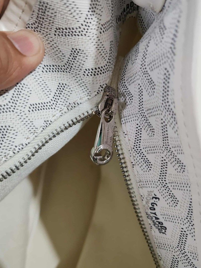 Goyard St. Louis PM Handbag (Category: Luxury Bags & Wallets) located in Cabanatuan. Submitted by chinithou (Listing ID 1405944624, Image 2). Description: - Goyard St. Louis PM - Signature Goyardine canvas - White and grey chevron pattern - Shoulder strap - Zipper closure - Visible interior lining - Silver-toned hardware - Classic and stylish - Missing pouch.
