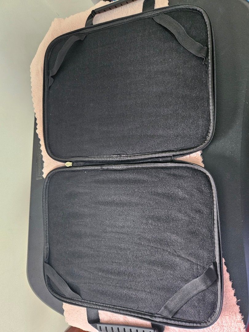 Halo Laptop Sleeve (Category: Laptop Bags & Sleeves) located in Marilao. Submitted by mamiai_store (Listing ID 1405945250, Image 2). Description: Halo laptop sleeve features a quilted design and a handle for easy carrying. It has a zipper closure and a soft interior to protect your device. The interior has two compartments with elastic straps. It is designed to fit a laptop and other accessories..