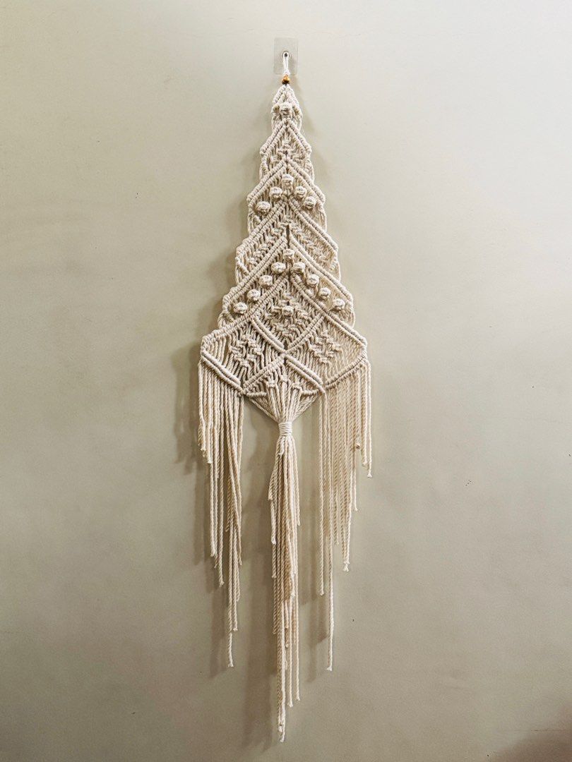 Macrame Cristmas Tree Wall Decor (Category: Wall Decor) located in Pasig City. Submitted by sinta_studio (Listing ID 1405912246, Image 1). Description: Macrame Christmas Tree Wall Decor. Handcrafted design. Ready to hang and add a festive touch to your space..