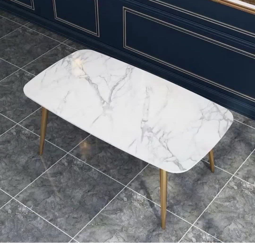 Dining Table (Category: Tables & Sets) located in Singapore. Submitted by greenlifetime (Listing ID 1405947341, Image 3). Description: - White marble-look dining table with gold legs - Suitable for small to medium dining areas Dimension: 160cm x 80cm x 75cm Size good for 4-6 pax Listing is for dining table. Been with me for over 1 year. In good condition. Welcome to view actual item prior to purchase Family has no pets and non-smoking household. 