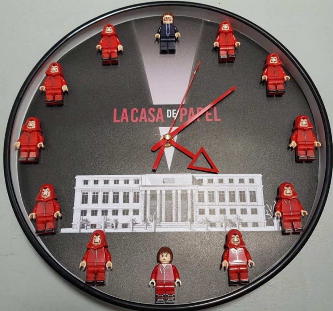 Money Heist (La Casa De Papel) Customized Minifigure Clock (Category: Clocks) located in Manila. Submitted by skadooshcorner (Listing ID 1405939039, Image 1). Description: Money Heist Clock Approximately 11.5 inches diameter Customized with Minifigures Includes the following Minifigures: 1 x The Professor 1x Tokyo 10 x Money Heist Minifigures Collectible.