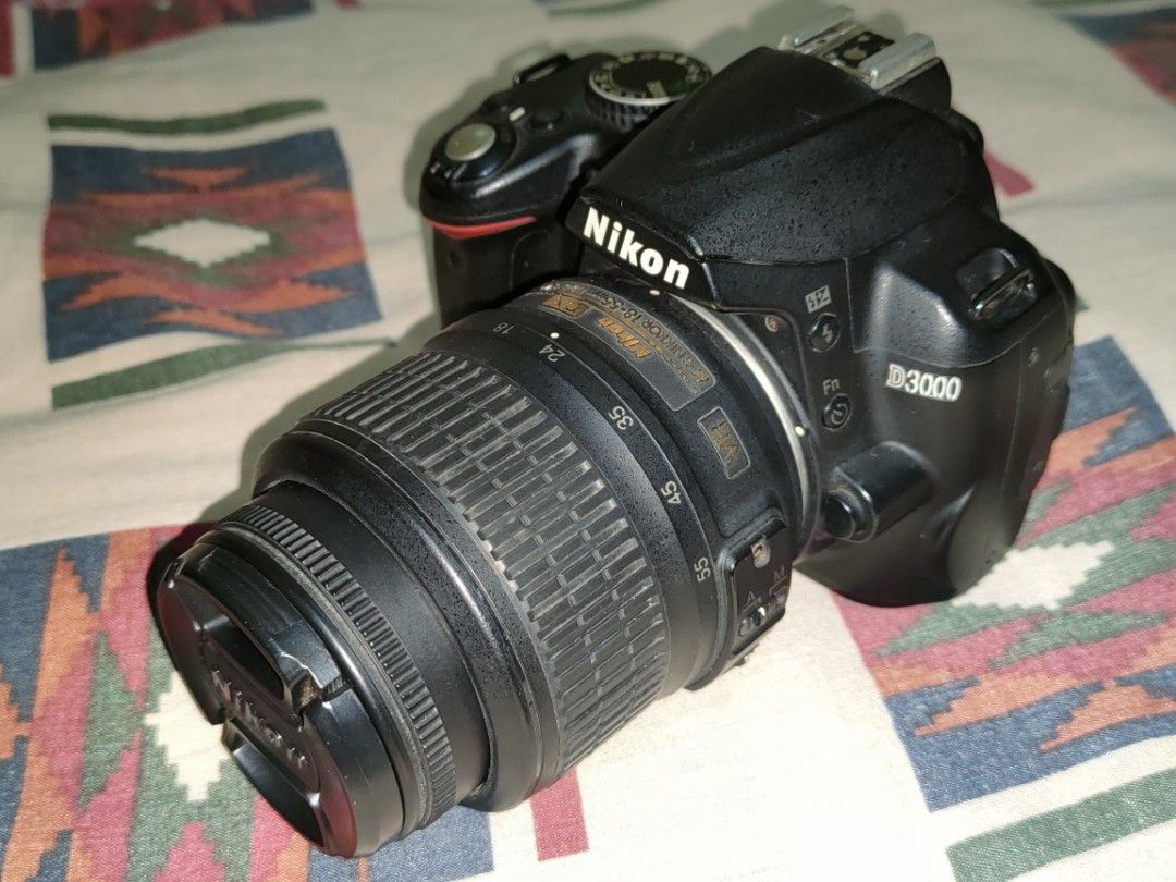 Nikon D3000 DSLR Camera with Flash (Category: Cameras) located in Calamba. Submitted by mrbustamante223 (Listing ID 1406033748, Image 2). Description: - Nikon D3000 DSLR camera kit - Includes: - Camera body - Lens with lens cap - National flash unit - Battery - Charger - SD card - Power cable Bundle sale issue: -vignete screen -flash di nagana -need cleaning may fungus build up na( ilang yrs na din kasi nka tambak sa apartment). -negotiable pa.