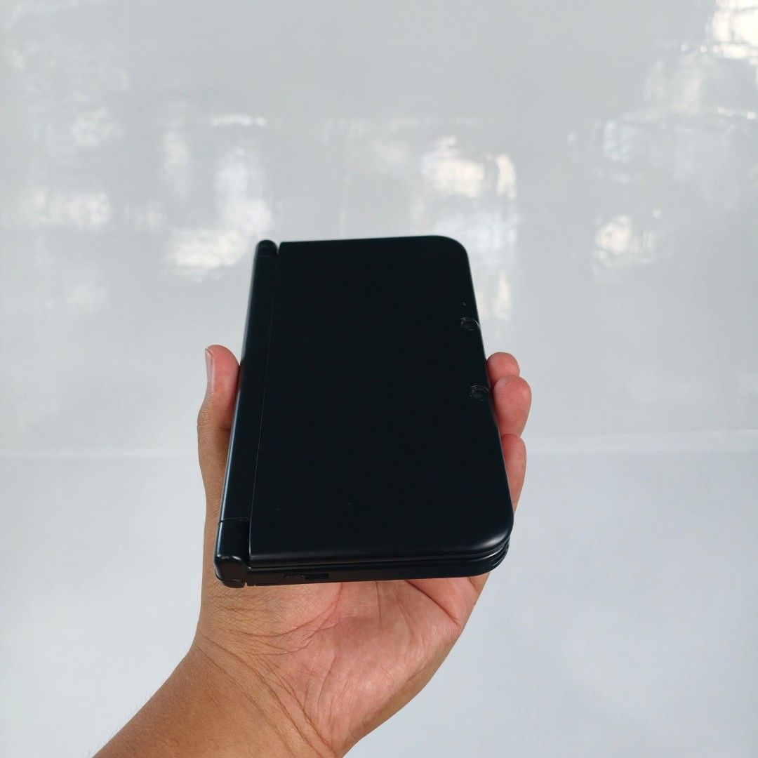 Nintendo 3DS XL Black Complete Box (Category: Nintendo) located in Plaridel. Submitted by tocilevelup011317 (Listing ID 1405950608, Image 3). Description: FOR SALE: NINTENDO 3DS XL BLACK COMPLETE BOX ✅ COP & MEET UP ✅ CAN DO VIDEO CALL FOR TESTING ✅ 9/10 CONDITION ✅ BOTH SCREENS ARE GOOD ✅ 7 DAYS WARRANTY FOR PEACE OF MIND ✅ HSHOP INSTALLED (CAN DL ANY 3DS GAMES VIA WIFI) ✅ CAN REQUEST 3DS OR DS GAMES INCLUSIONS : BOX UNIT STYLUS MANUAL AR CARDS 