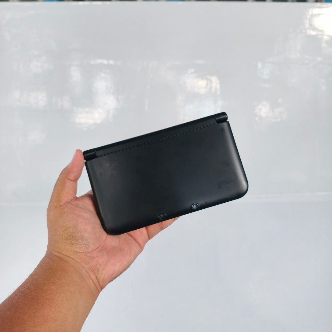 Nintendo 3DS XL Black Complete Box (Category: Nintendo) located in Plaridel. Submitted by tocilevelup011317 (Listing ID 1405950608, Image 2). Description: FOR SALE: NINTENDO 3DS XL BLACK COMPLETE BOX ✅ COP & MEET UP ✅ CAN DO VIDEO CALL FOR TESTING ✅ 9/10 CONDITION ✅ BOTH SCREENS ARE GOOD ✅ 7 DAYS WARRANTY FOR PEACE OF MIND ✅ HSHOP INSTALLED (CAN DL ANY 3DS GAMES VIA WIFI) ✅ CAN REQUEST 3DS OR DS GAMES INCLUSIONS : BOX UNIT STYLUS MANUAL AR CARDS 