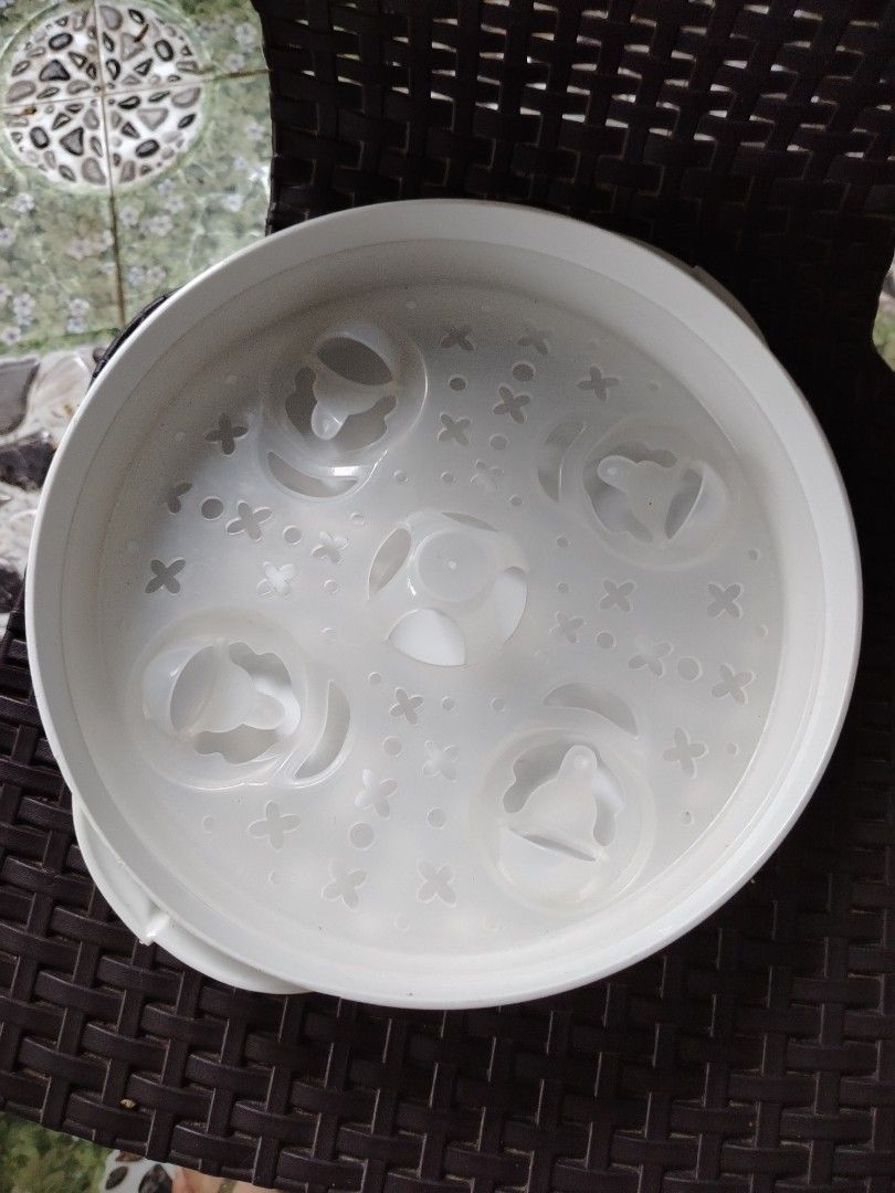 NUK Microwave Bottle Sterilizer (Category: Breastfeeding & Bottle Feeding) located in Tayasan. Submitted by _raceprettyconcept (Listing ID 1405962382, Image 2). Description: Lightly used With dent Microwave express sterilizer.