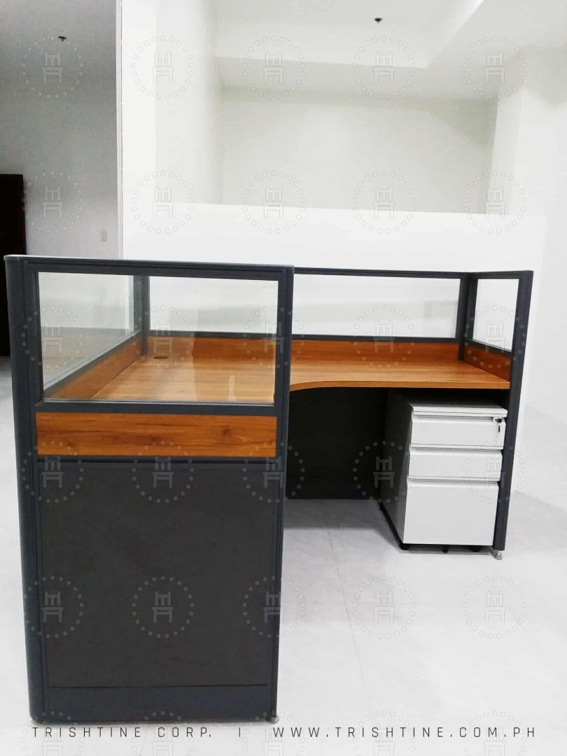 Office Cubicle L-Type with Glass Partition (Category: Office Furniture & Fixtures) located in Quezon City. Submitted by evon_trishtinecorp. (Listing ID 1405931701, Image 3). Description: - Modern office cubicles - Dark gray frame - Wooden tabletop - Glass partition - Available in L-shaped and rectangular configurations - Optional rolling drawer cabinet - Durable and functional - Ideal for individual workspaces Call or Message me - Zero Nine Five 
