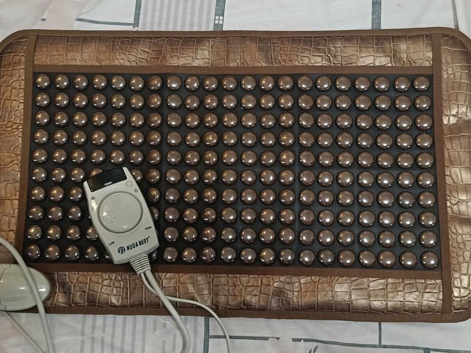 Original Nugabest Tourmanium Heating Pad (Category: Massage Devices) located in Manila. Submitted by chester_lim (Listing ID 1405943472, Image 2). Description: For Sale: Original Nugabest Tourmanium Heating Pad Condition: In excellent working condition. Like New. Selling for P14,500.00 - Features a control panel for temperature adjustment (low and high settings). - Designed with numerous round massage nodes. - Rectangular shape. - Intended for th