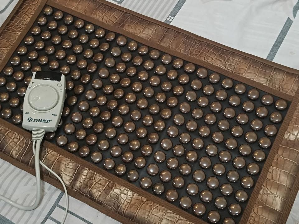 Original Nugabest Tourmanium Heating Pad (Category: Massage Devices) located in Manila. Submitted by chester_lim (Listing ID 1405943472, Image 3). Description: For Sale: Original Nugabest Tourmanium Heating Pad Condition: In excellent working condition. Like New. Selling for P14,500.00 - Features a control panel for temperature adjustment (low and high settings). - Designed with numerous round massage nodes. - Rectangular shape. - Intended for th