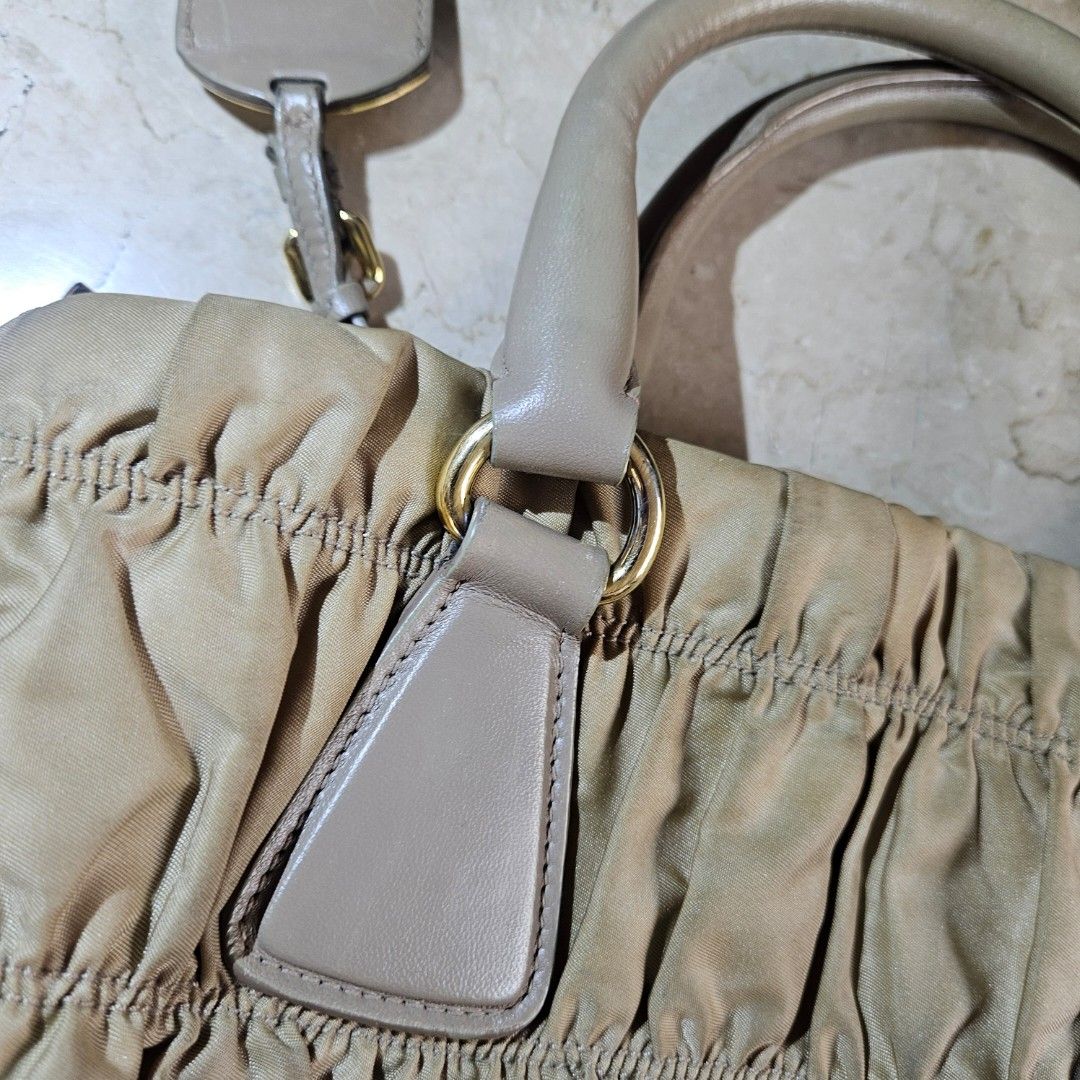 Prada Tessuto Gaufre Camello Handbag (Category: Luxury Bags & Wallets) located in Quezon City. Submitted by killerkevvv (Listing ID 1405933952, Image 3). Description: Kindly check photos for inclusions - Authentic Prada handbag - Beige color - Top handle and detachable shoulder strap - Interior zippered pocket - Includes authenticity card - Textured fabric exterior.