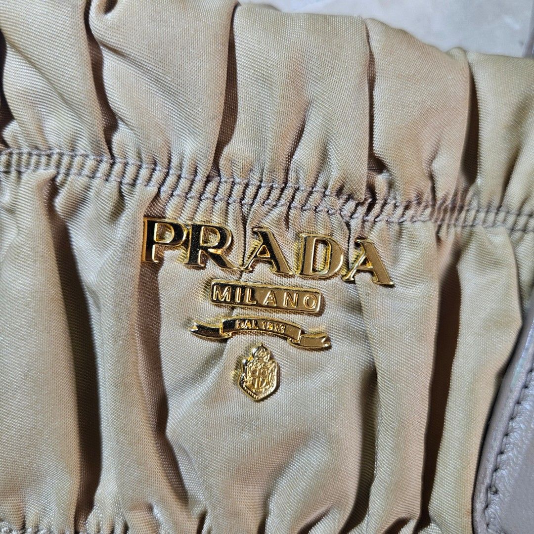 Prada Tessuto Gaufre Camello Handbag (Category: Luxury Bags & Wallets) located in Quezon City. Submitted by killerkevvv (Listing ID 1405933952, Image 2). Description: Kindly check photos for inclusions - Authentic Prada handbag - Beige color - Top handle and detachable shoulder strap - Interior zippered pocket - Includes authenticity card - Textured fabric exterior.