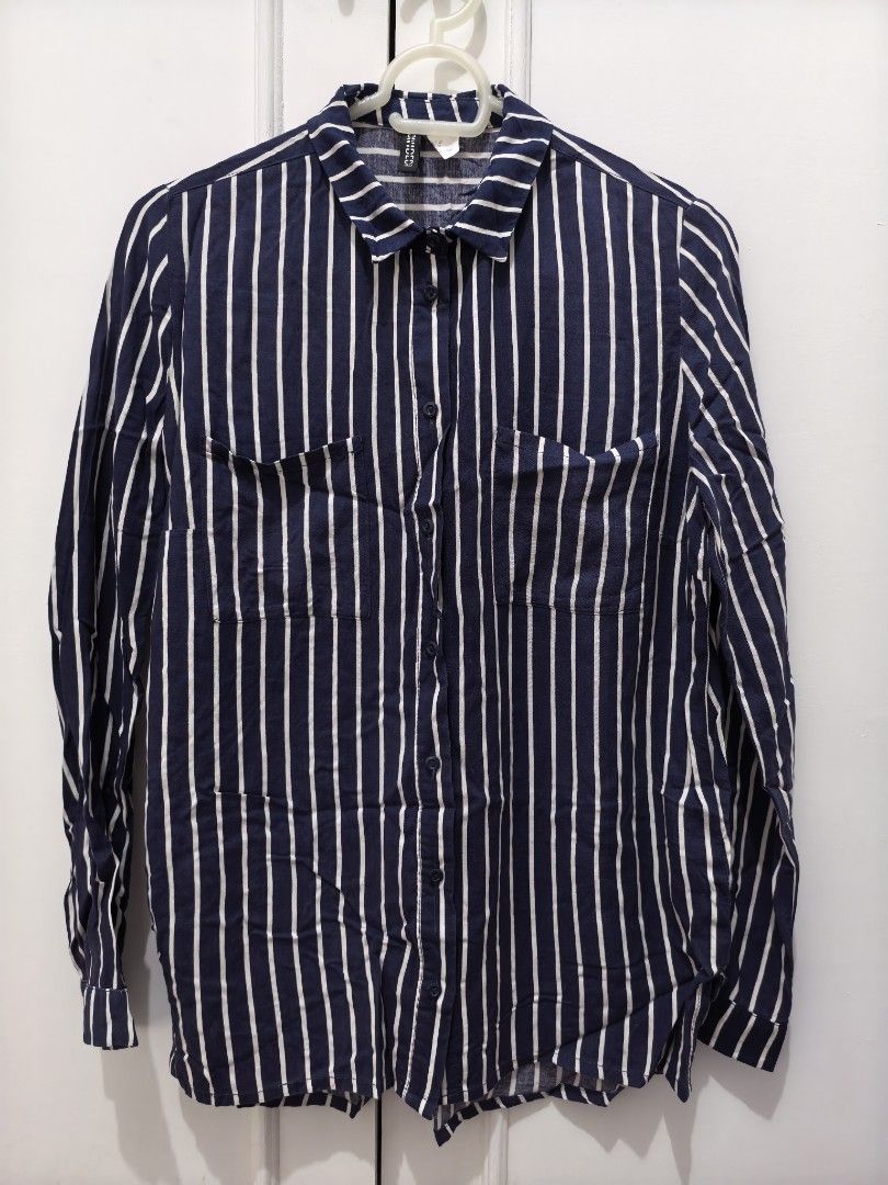 PRE-LOVED BLOUSE /OFFICE TOP/Divided BY H&M (Category: Blouses) located in Mandaluyong City. Submitted by berriesweet (Listing ID 1406051729, Image 2). Description: - Pre-loved H&M Divided blouse - Size: M - Design: Navy and white stripes - Style: Office top / Casual - Condition: 7/10.
