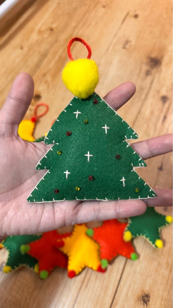 [SET] Curated/Handmade Felt Christmas Ornaments (Category: Other Home Decor) located in Cabuyao City. Submitted by mamamara19 (Listing ID 1406050329, Image 3). Description: - Handmade felt Christmas ornaments - Features star and Christmas tree designs - Vibrant colors [Big Star and Tree (10cm) Mini Stars (7.5cm)] - Perfect for gifting or decorating - Meetup locations: Solenad and Uptown Mall (Tuesdays only).
