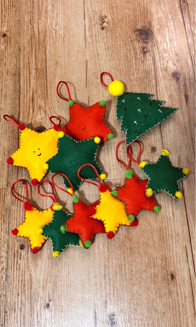[SET] Curated/Handmade Felt Christmas Ornaments (Category: Other Home Decor) located in Cabuyao City. Submitted by mamamara19 (Listing ID 1406050329, Image 2). Description: - Handmade felt Christmas ornaments - Features star and Christmas tree designs - Vibrant colors [Big Star and Tree (10cm) Mini Stars (7.5cm)] - Perfect for gifting or decorating - Meetup locations: Solenad and Uptown Mall (Tuesdays only).