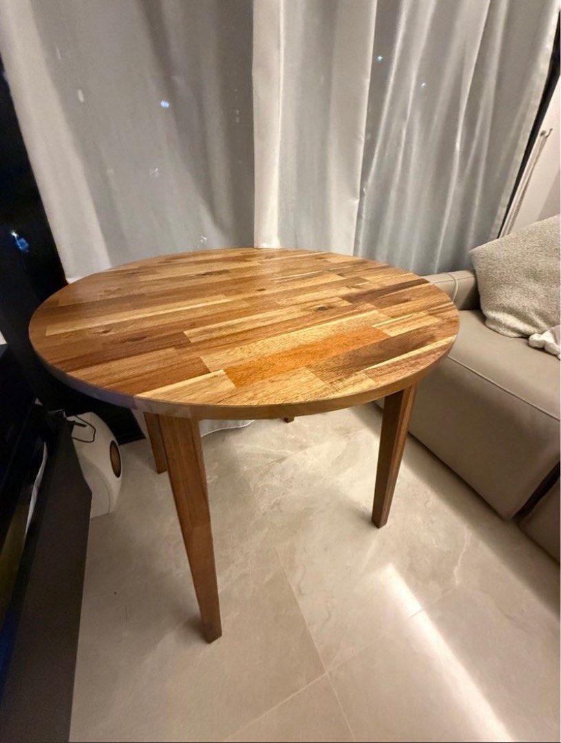 Solid Wood Round Dining Table (Category: Tables & Sets) located in Singapore. Submitted by ivyprep07037305 (Listing ID 1405970700, Image 1). Description: - Solid acacia wood - Like new, no scratches / chips / etc - 80cm diameter - Selling to upgrade to larger table.