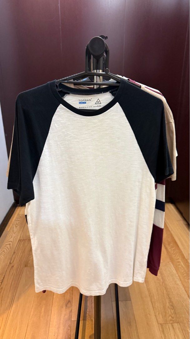 Topman Raglan T-shirt (Category: Tshirts & Polo Shirts ) located in Quezon City. Submitted by tanweshop (Listing ID 1405990285, Image 1). Description: - Topman Raglan T-shirt - Size: Medium - Color: Black sleeves, white body - Design: Classic raglan - Neckline: Crew neck - Material: Lightweight fabric.