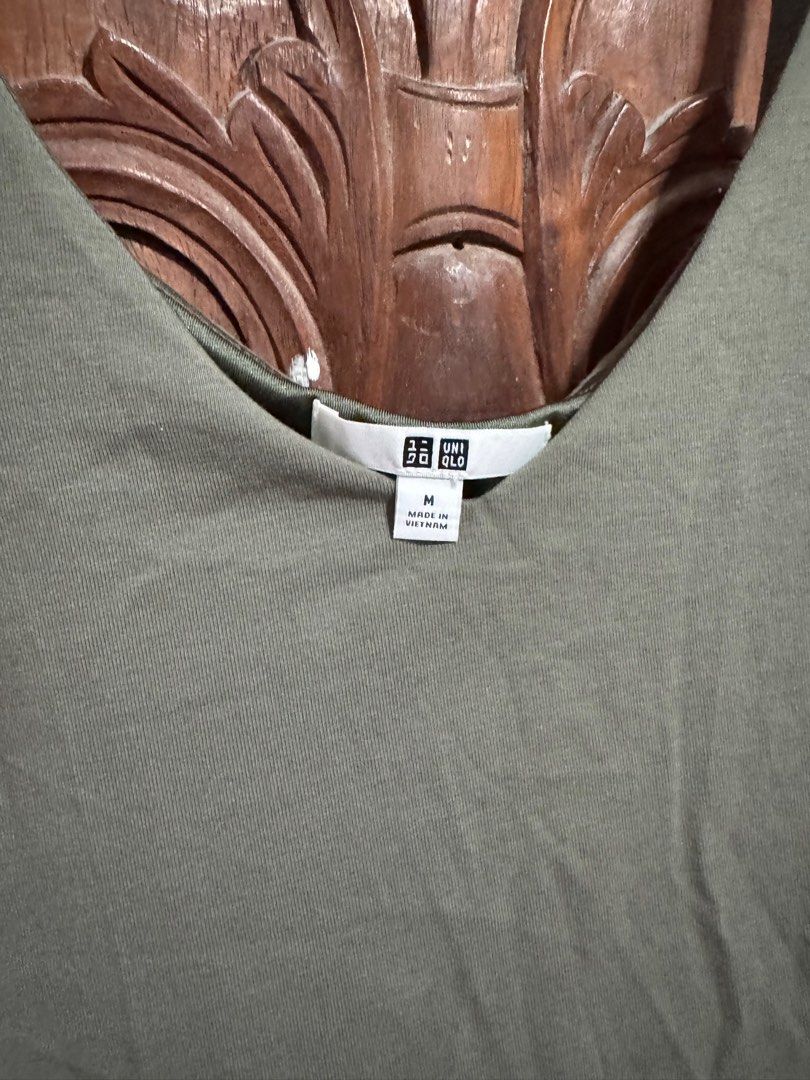 Uniqlo Olive Green Jumpsuit (Category: Jumpsuits) located in Palayan City. Submitted by decluttering_2018 (Listing ID 1406095284, Image 3). Description: - Uniqlo olive green jumpsuit - Size: M - Features: - Spaghetti strap top - Wide leg bottom - Pockets - V-neck - Made in Vietnam - Fabric: - Shell: 48% polyester, 48% rayon, 4% spandex - Lining: 100% polyester.