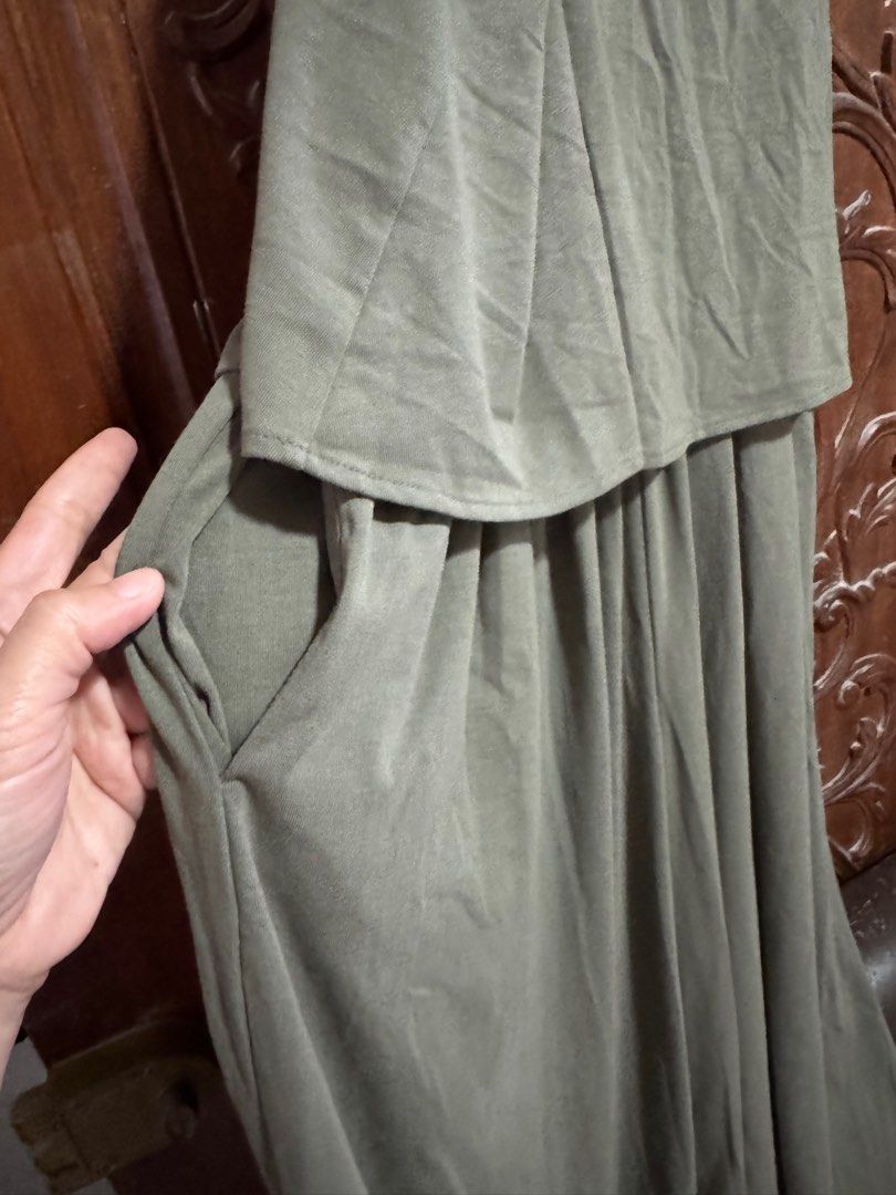 Uniqlo Olive Green Jumpsuit (Category: Jumpsuits) located in Palayan City. Submitted by decluttering_2018 (Listing ID 1406095284, Image 2). Description: - Uniqlo olive green jumpsuit - Size: M - Features: - Spaghetti strap top - Wide leg bottom - Pockets - V-neck - Made in Vietnam - Fabric: - Shell: 48% polyester, 48% rayon, 4% spandex - Lining: 100% polyester.