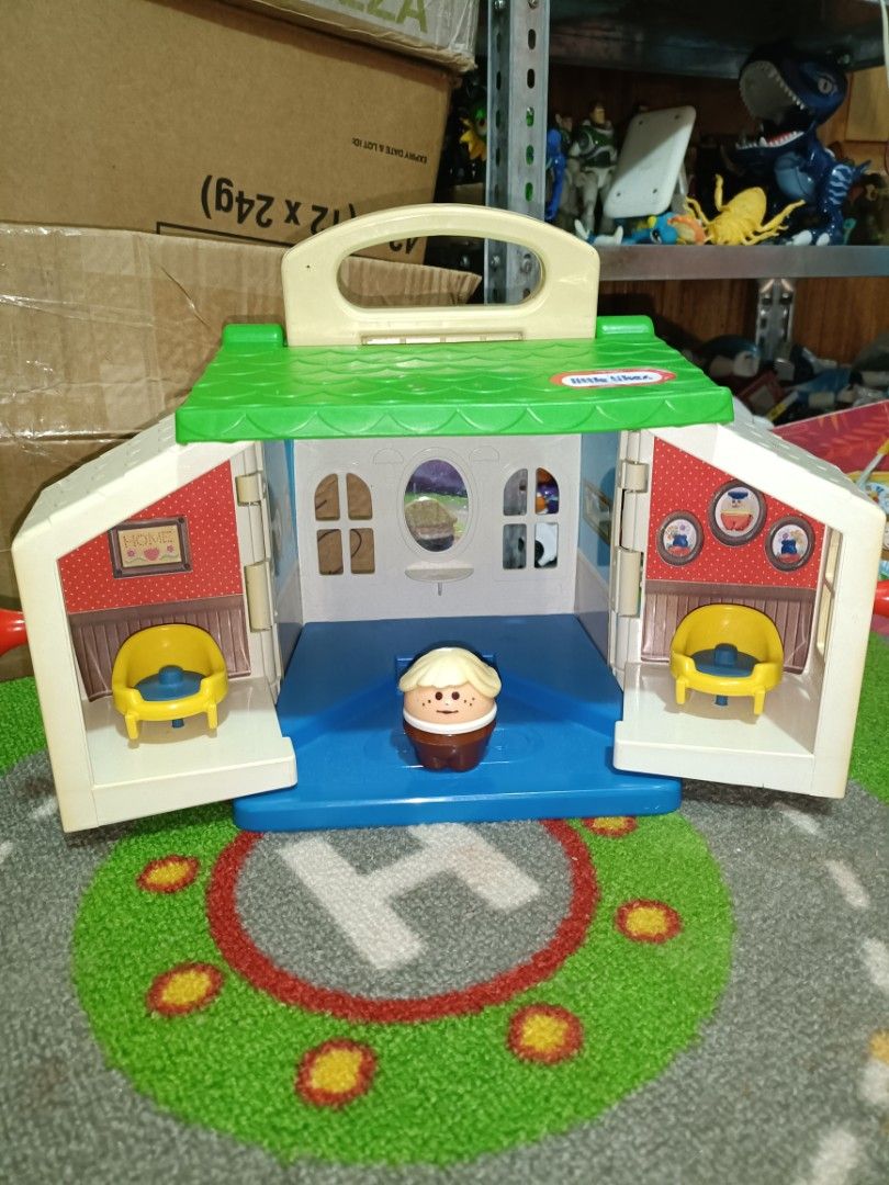 Vintage little tikes toddle tots (Category: Kids Toys) located in Iligan City. Submitted by shehabdor98515 (Listing ID 1406014837, Image 2). Description: - Little Tikes Playhouse set - Features: - Green roof - Blue floor - Two yellow chairs - Picture-decorated walls - Includes: - Red and yellow car with blue wheels - Brown and white figure.