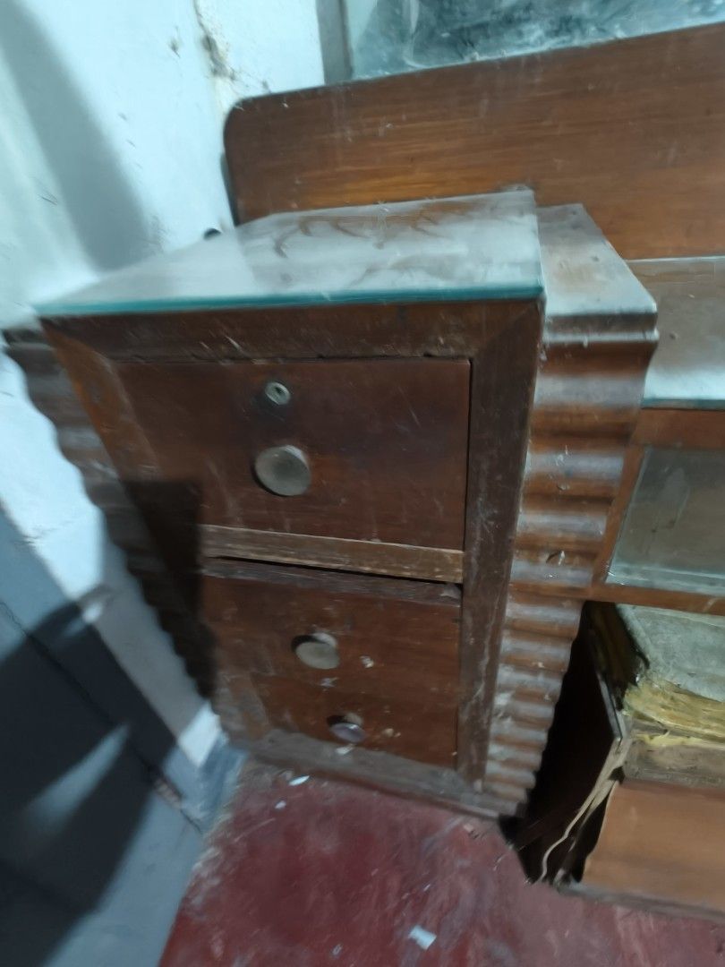 Vintage Wooden Vanity Table with Mirror (Category: Tables & Sets) located in Makati City. Submitted by zeus462 (Listing ID 1406008514, Image 3). Description: - Vintage vanity table - Wooden construction - Built-in mirror - Includes drawers and a side cabinet - Classic rectangular design - Features glass top (some sections) - Unique, older aesthetic.