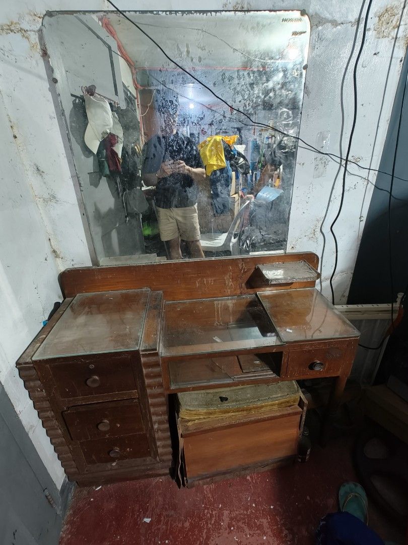 Vintage Wooden Vanity Table with Mirror (Category: Tables & Sets) located in Makati City. Submitted by zeus462 (Listing ID 1406008514, Image 1). Description: - Vintage vanity table - Wooden construction - Built-in mirror - Includes drawers and a side cabinet - Classic rectangular design - Features glass top (some sections) - Unique, older aesthetic.