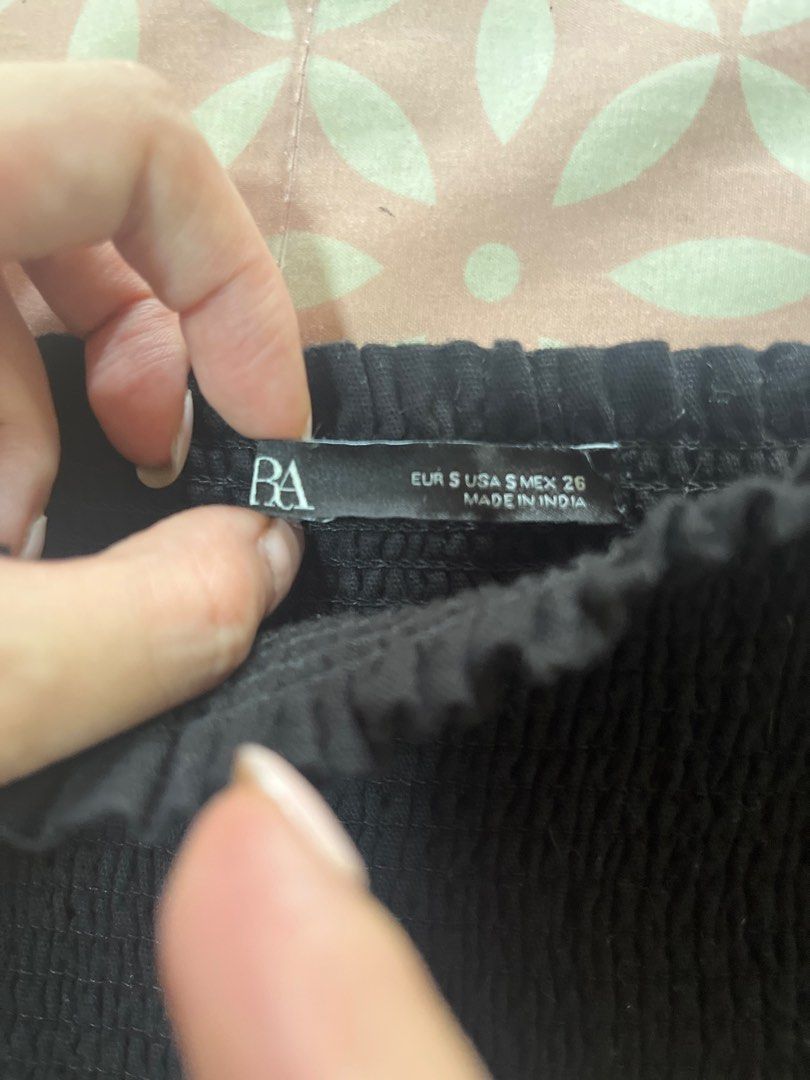 Zara Black Ruffle Tube Top (Category: Sleeveless) located in Mandaluyong City. Submitted by andiwears (Listing ID 1405950834, Image 2). Description: - Black strapless top - Features a ruffled hem - Smocked bodice - Size: S - Made in India - Solid black color - Slightly peplum.
