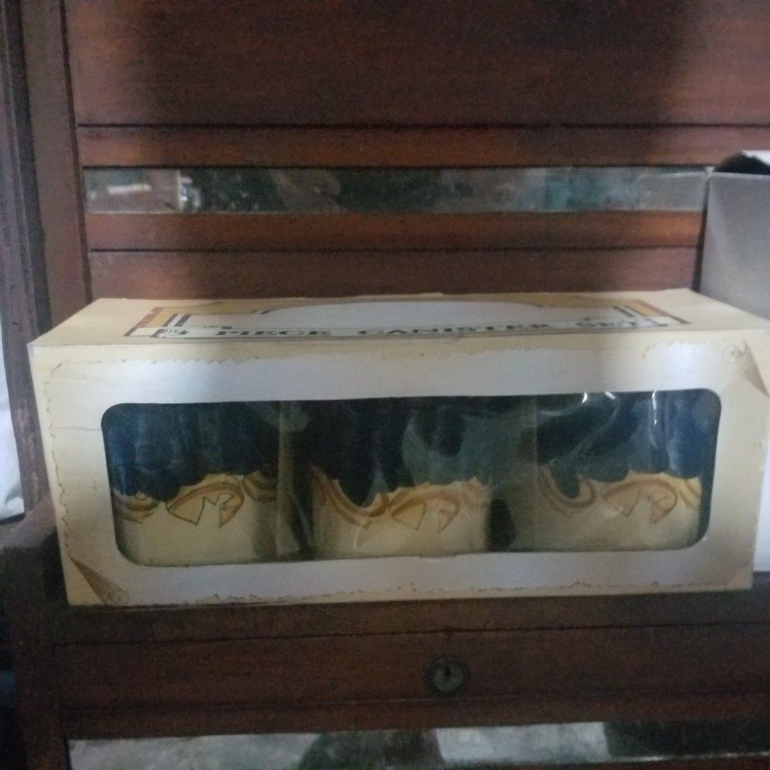 3 Piece Canister Set (Category: Food Organization & Storage) located in Paranaque City. Submitted by showboat (Listing ID 1406106027, Image 1). Description: - 3-piece canister set - Elegant blue and gold design - Brand new, in original box - Box includes a window to view the canisters - Clearly labeled '3 PIECE CANISTER SET'.