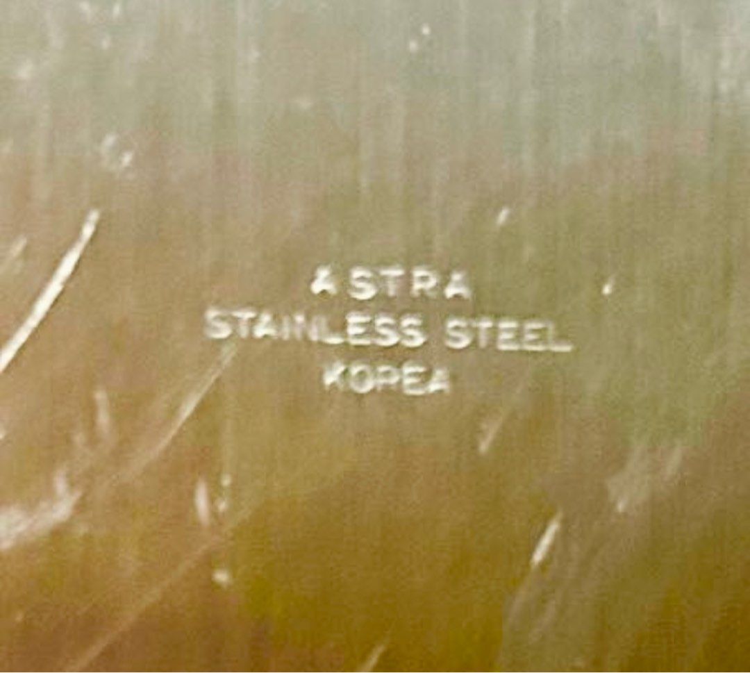 Astra Stainless Steel Serving Tray (Category: Other Kitchenware & Tableware) located in Las Pinas. Submitted by rjmwings (Listing ID 1406119561, Image 3). Description: Astra Stainless Steel Serving Tray Made in Korea Elegant oval serving tray made of stainless steel. Features a decorative floral border. The tray is marked with the "ASTRA STAINLESS STEEL KOREA" stamp. Perfect for serving food or displaying items. A classic piece that adds a touch 