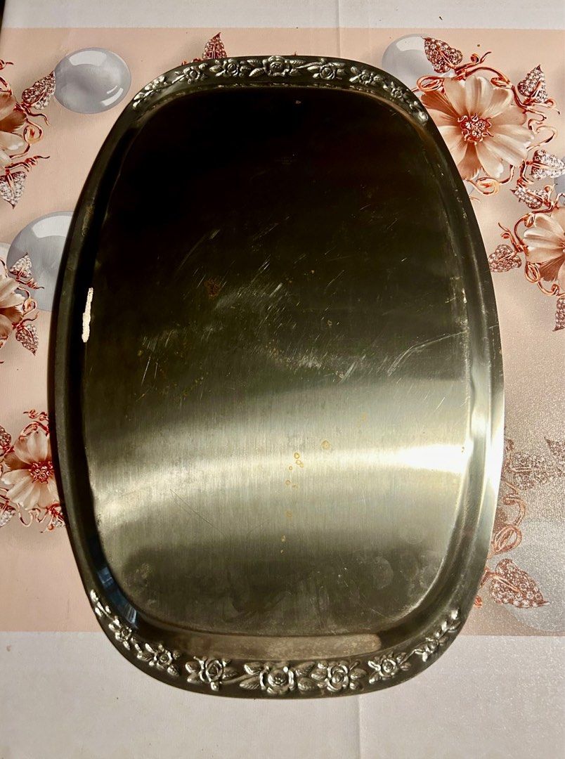 Astra Stainless Steel Serving Tray (Category: Other Kitchenware & Tableware) located in Las Pinas. Submitted by rjmwings (Listing ID 1406119561, Image 2). Description: Astra Stainless Steel Serving Tray Made in Korea Elegant oval serving tray made of stainless steel. Features a decorative floral border. The tray is marked with the "ASTRA STAINLESS STEEL KOREA" stamp. Perfect for serving food or displaying items. A classic piece that adds a touch 