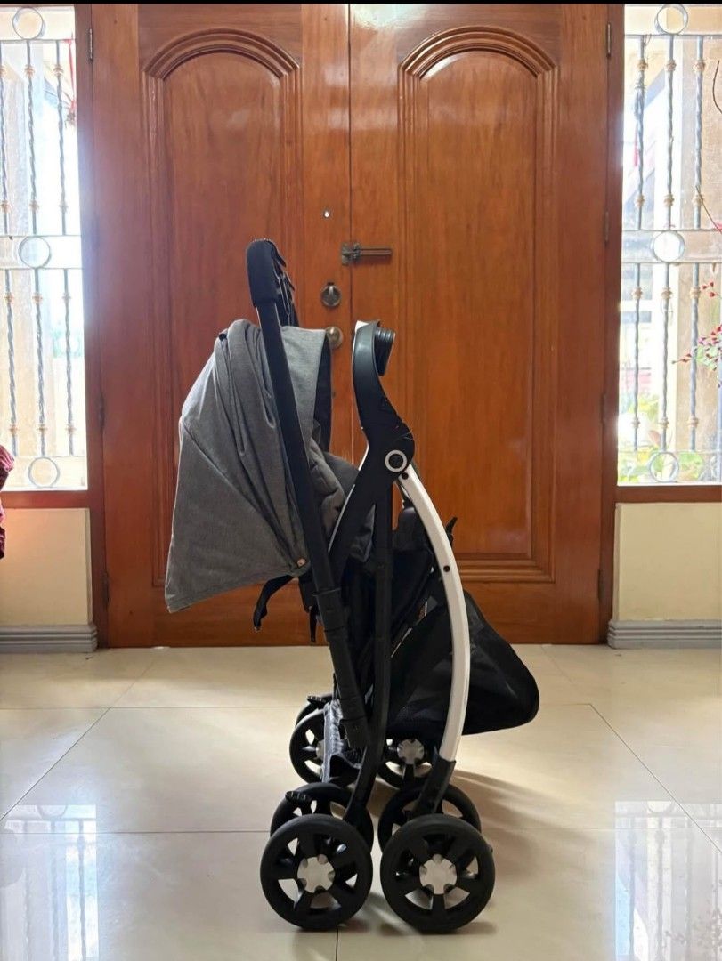 Baby Company Alix - Reversible Stroller (Category: Strollers) located in Pasig City. Submitted by lou014 (Listing ID 1406171777, Image 3). Description: - Grey canopy - Black frame with white accents - Storage basket - Handle with attachments - Four wheels - Foldable design RFS: Ayw na ni baby Looks: Good as new!.
