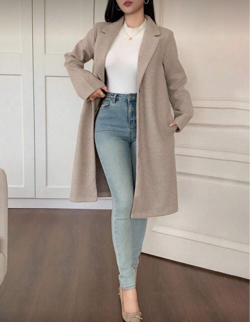 Beige Long Coat good for autumn (Category: Coats, Jackets and Outerwear) located in Quezon City. Submitted by active_assets (Listing ID 1406281517, Image 3). Description: - Elegant beige long coat - Classic lapel collar - Single-button closure - Two front pockets - Tailored fit - Soft, woven fabric - Perfect for layering -Fits Medium frames -never used, only cleaned and washed rfs japan trip got cancelled.