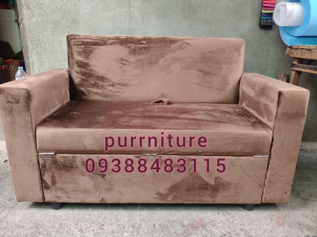 Brown Sofa Bed with Storage (Category: Sofas) located in Marikina City. Submitted by querrygonzaga30 (Listing ID 1406185124, Image 2). Description: MADE TO ORDER OUR FIRST DETACHABLE ARMREST 1 PC 40X16X16 OTTOMAN STORAGE 1 PC 50X24X16 SOFA WITH STORAGE Foam: 4 inches URATEX FOAM Material: SOFIA #2 - Brown sofa bed - Converts into a bed - Features pull-out storage - Made of soft, brown fabric - Includes armrests and backrest - Comes with a matchin